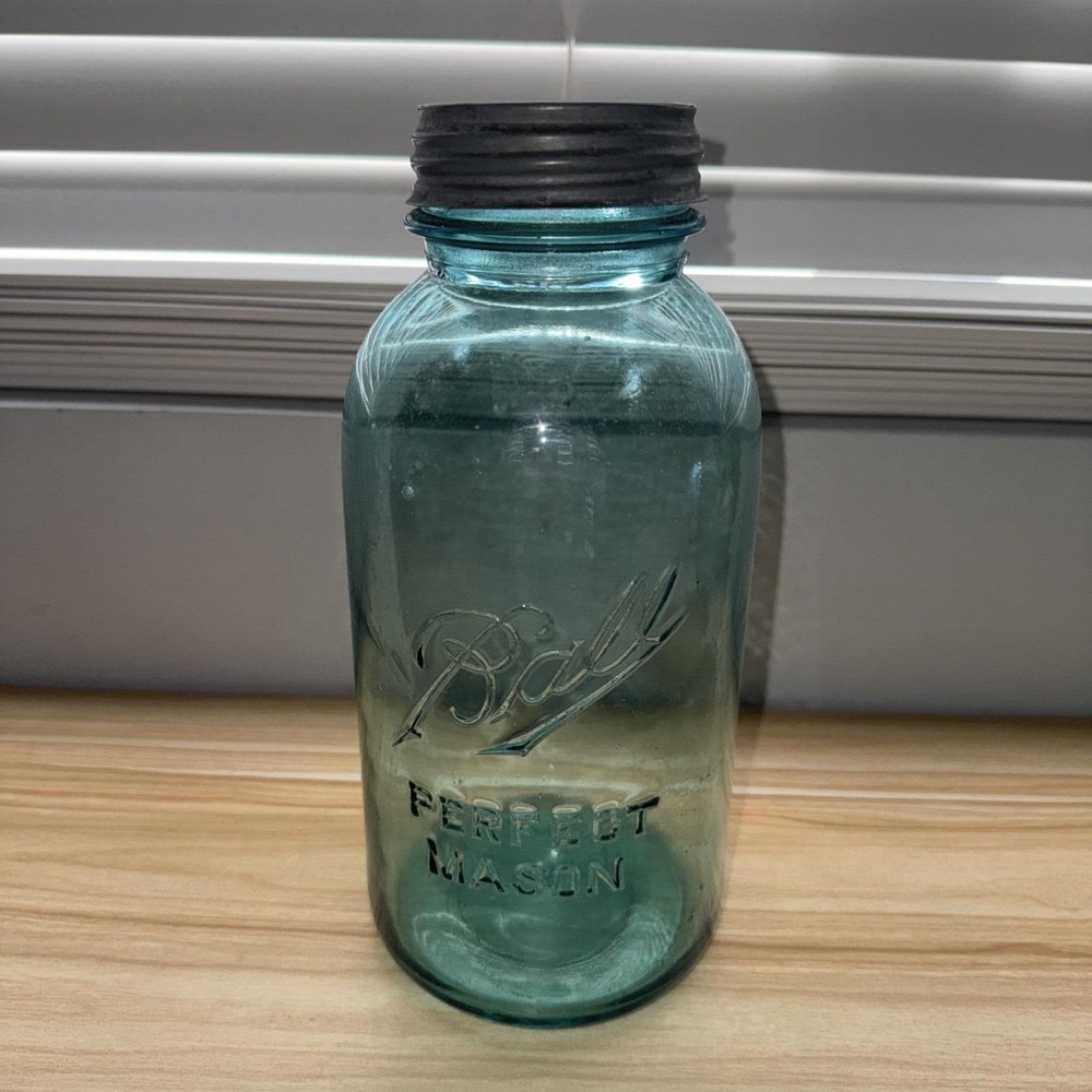 Ball jar Perfect Mason #7 in aqua blue glass. Zinc lid. 9 in w/o lid. Vintage